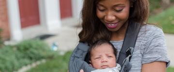 Photo of a young African American mother with her baby