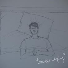 A hand drawn sketch of a man lying awake in bed with the text "trouble sleeping?" overlaid in cursive. 